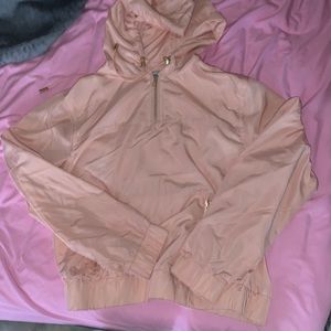 Light pale pink jacket.